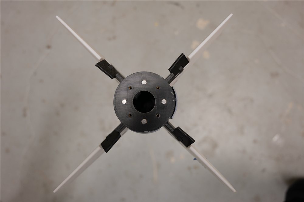 Fin tabs deflected to the right, seen from behind
